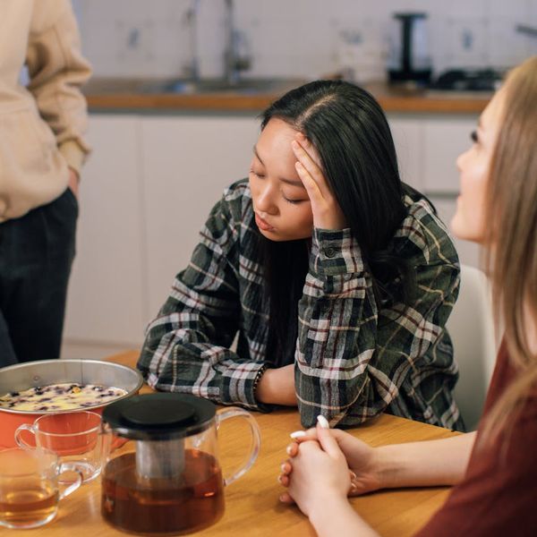 A person enjoying a quiet moment with a cup of tea, representing a balanced lifestyle.